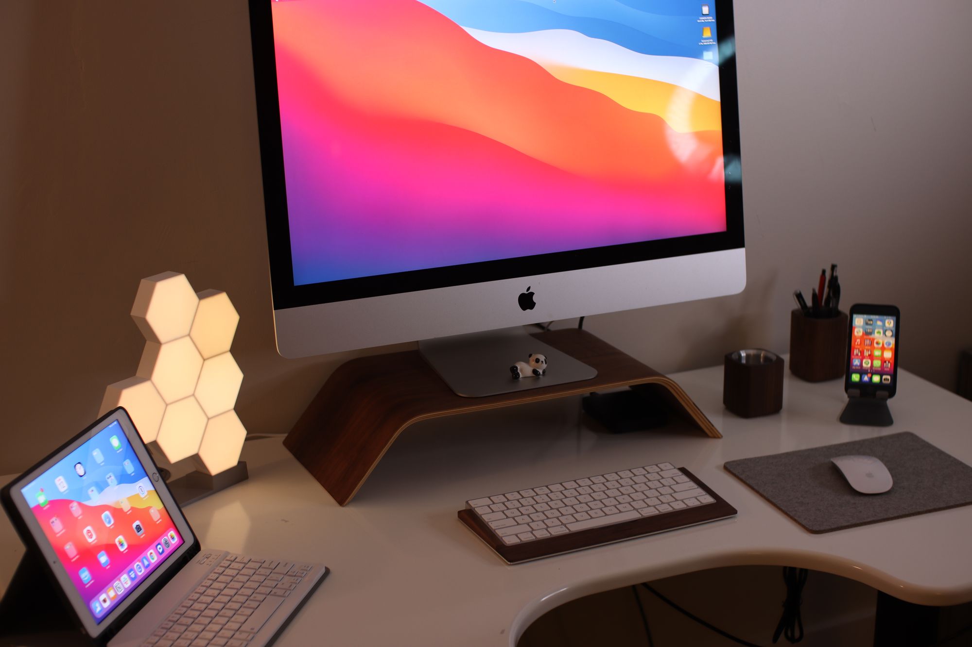 Night shot of desk with ipad phone and geometric light