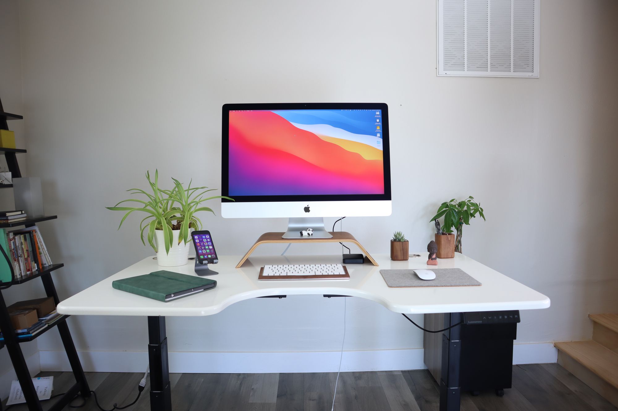 iMac on sit to stand desk, white with black legs in standing position